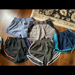 assorted nike, UA, and adidas running shorts